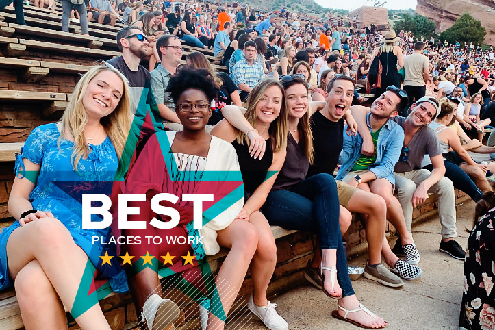 Group of 3Q employees sitting together at the Red Rocks Amphitheatre