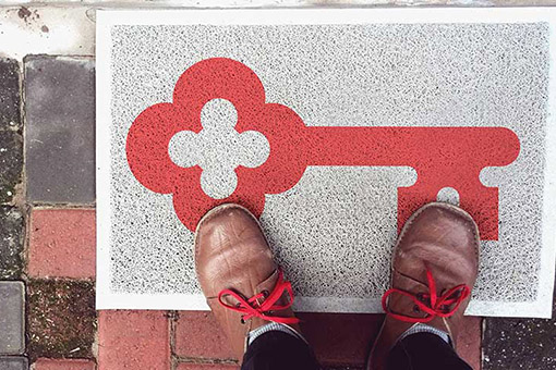 Feet on a doormat with Keybank logo
