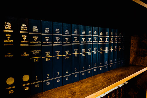 A row of books of legal codes in Massachusetts