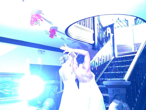 Amie Crawford and wife at their wedding throwing flower bouquet