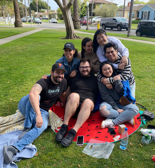 Andrew surrounded by friends in park