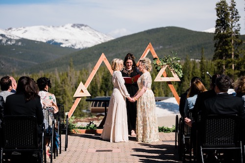 Erin and wife at alter on wedding day
