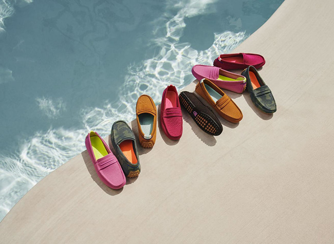 A group of loafers in various colors next to a pool
