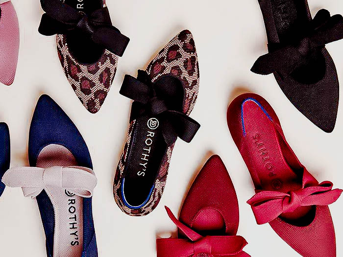 A collection of colorful pointed ballet-style flats with bows