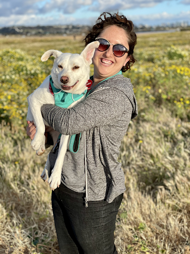 Madeline holding her dog
