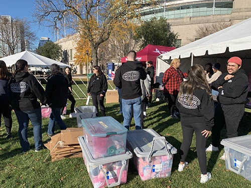 DEPTsters organizing tshirts at fundraiser