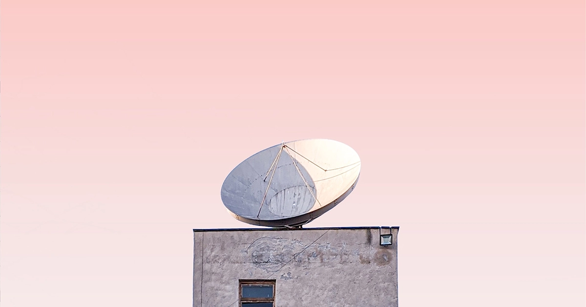 A dish satellite atop a building